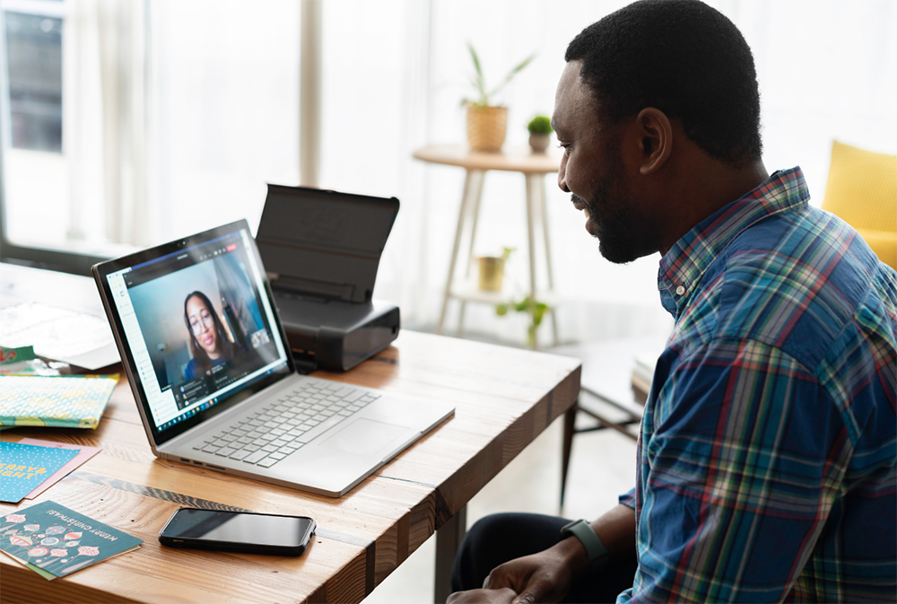 Man on laptop seeking access to virtual clinic