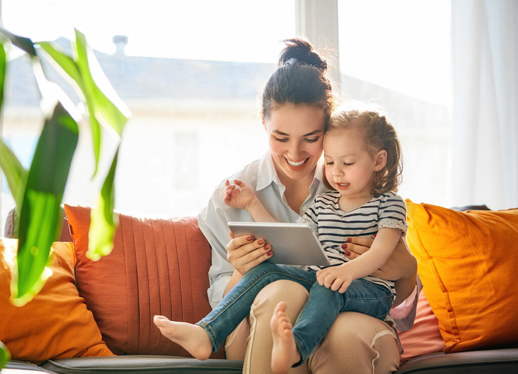 mom and child talking to online doctor at virtual clinic with a family doctor